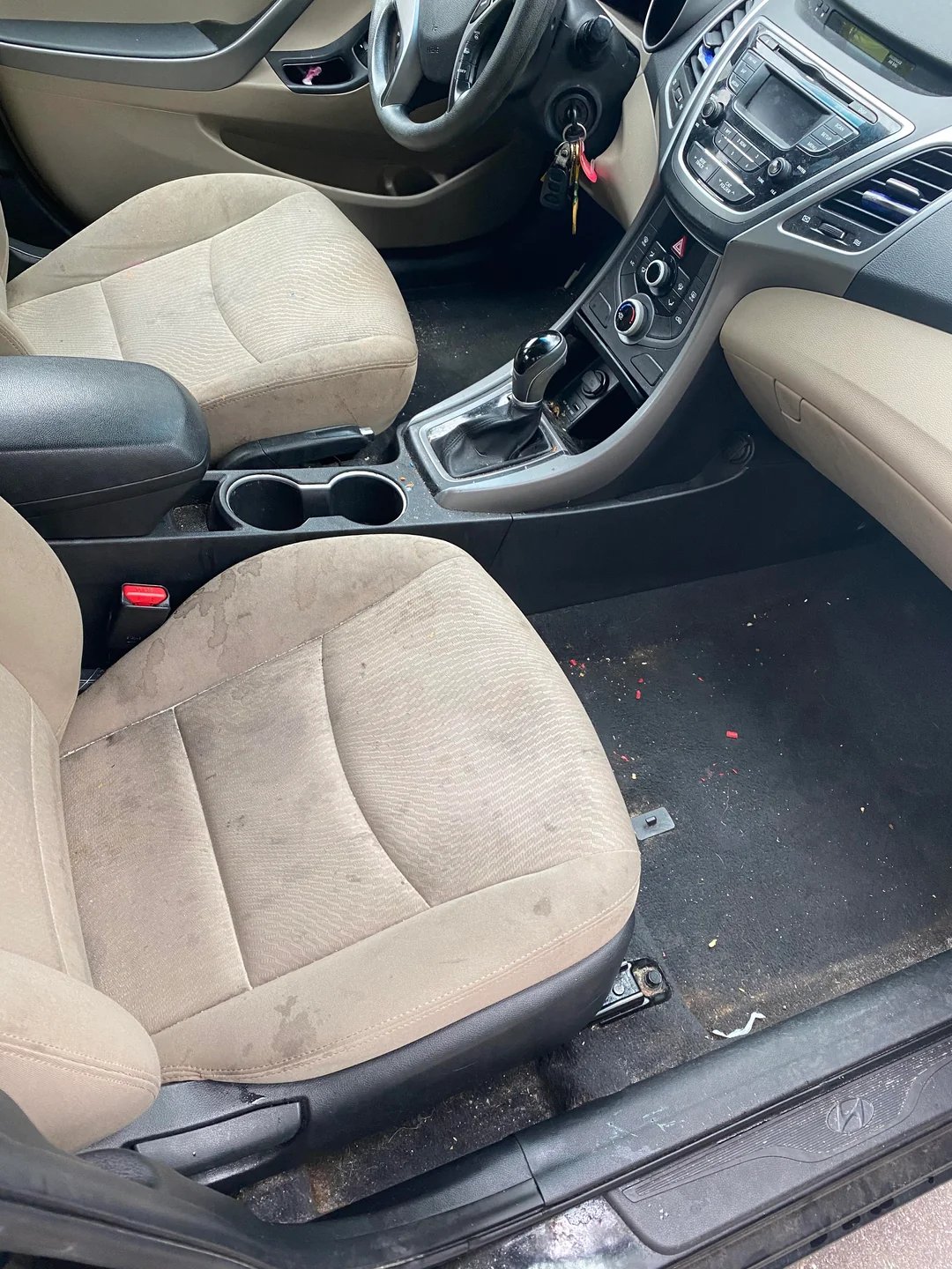 Professionally restored vehicle seat showing remarkable improvement in condition